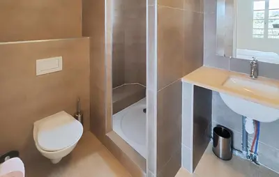 a bathroom with a toilet and a sink at Nice Home In Saint-Laurent-De-La-Ca in Saint-Laurent-de-la-Cabrerisse