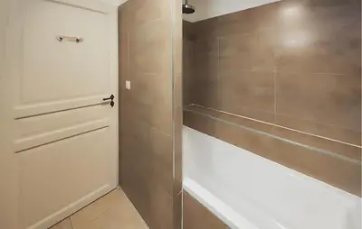 a bathroom with a shower with a glass door at Nice Home In Saint-Laurent-De-La-Ca in Saint-Laurent-de-la-Cabrerisse