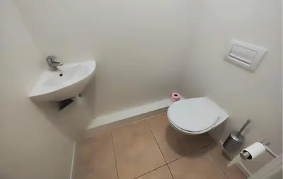 a bathroom with a white toilet and a sink at Nice Home In Saint-Laurent-De-La-Ca in Saint-Laurent-de-la-Cabrerisse