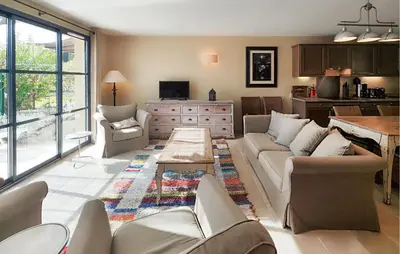 a living room with a couch and a table at Stunning Home In Saint-Laurent-De-La-Ca in Saint-Laurent-de-la-Cabrerisse