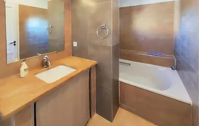 a bathroom with a sink and a shower and a tub at Stunning Home In Saint-Laurent-De-La-Ca in Saint-Laurent-de-la-Cabrerisse