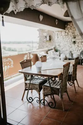 a dining room with a table and chairs and a window at Belle demeure de charme in Montels