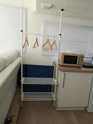 a small room with a microwave on a table at Bateau Mama Mia in Narbonne