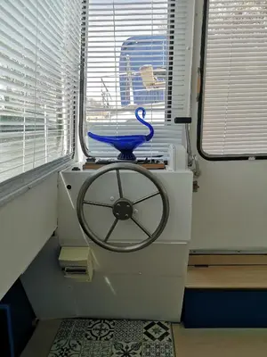 a washing machine with a blue bowl on top of it at Bateau Mama Mia in Narbonne