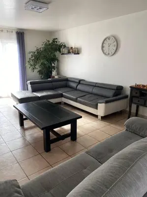 a living room with a couch and a coffee table at Villa calme avec piscine in Lavelanet