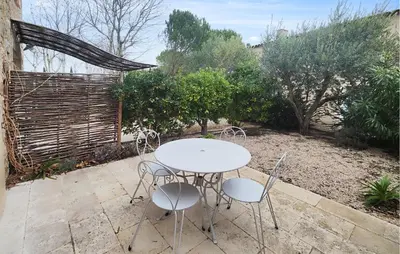 a white table and chairs on a patio at Nice Home In Saint-Laurent-De-La-Ca in Saint-Laurent-de-la-Cabrerisse