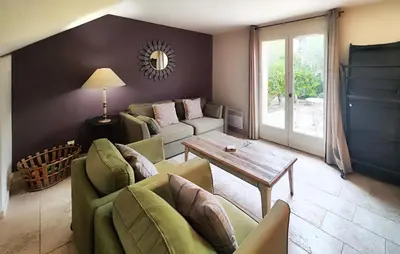 a living room with a couch and a table at Nice Home In Saint-Laurent-De-La-Ca in Saint-Laurent-de-la-Cabrerisse