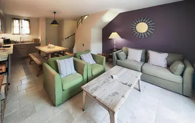 a living room with two couches and a table at Nice Home In Saint-Laurent-De-La-Ca in Saint-Laurent-de-la-Cabrerisse