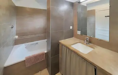 a bathroom with a sink and a mirror at Nice Home In Saint-Laurent-De-La-Ca in Saint-Laurent-de-la-Cabrerisse