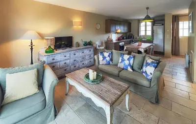 a living room with two couches and a coffee table at Nice Home In Saint-Laurent-De-La-Ca in Saint-Laurent-de-la-Cabrerisse