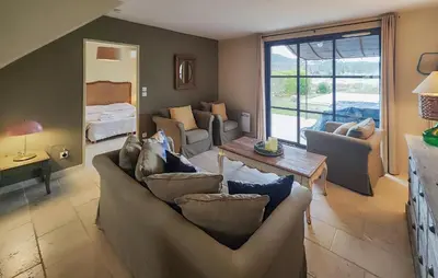 a living room with a couch and a table at Nice Home In Saint-Laurent-De-La-Ca in Saint-Laurent-de-la-Cabrerisse