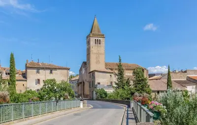 an empty road in a town with a clock tower at 2 Bedroom Gorgeous Home In Saint-Laurent-De-La-Ca in Saint-Laurent-de-la-Cabrerisse