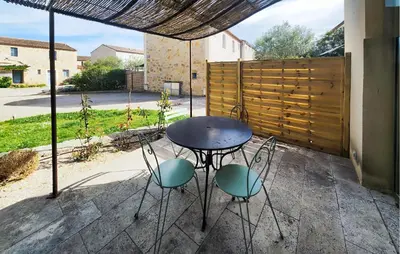 a table and chairs sitting on a patio at 1 Bedroom Amazing Home In Saint-Laurent-De-La-Ca in Saint-Laurent-de-la-Cabrerisse
