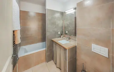 a bathroom with a sink and a shower at 2 Bedroom Cozy Home In Saint-Laurent-De-La-Ca in Saint-Laurent-de-la-Cabrerisse