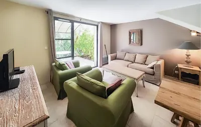 a living room with two couches and a tv at 2 Bedroom Gorgeous Home In Saint-Laurent-De-La-Ca in Saint-Laurent-de-la-Cabrerisse