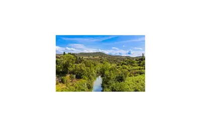 a river in the middle of a forest at 2 Bedroom Gorgeous Home In Saint-Laurent-De-La-Ca in Saint-Laurent-de-la-Cabrerisse