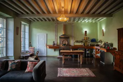 a living room with a couch and a table at Chateau in medieval Bastide - Sleeps up to 10 in Chalabre