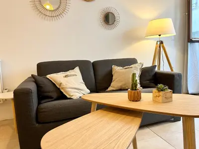a living room with a couch and a table at Studio centre historique RDC - WIFI in Revel