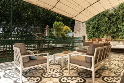two chairs and a table on a patio at Appartement chic, hôtel particulier, Carcassonne centre in Carcassonne