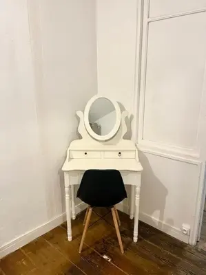 a white table with a mirror on it with a chair at Appartement Victor Hugo - balcon in Revel