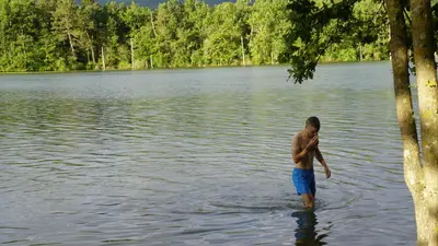 a man standing in a body of water at River House in medieval bastide - Sleeps up to 6 in Chalabre
