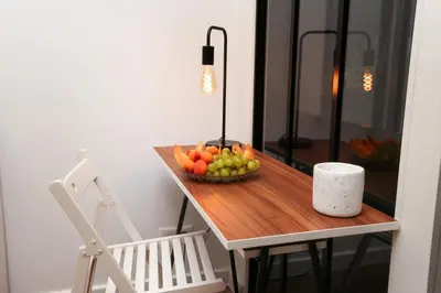 a table with a bowl of fruit on it at La Demeure du Chevalier d'Argent- parking gratuit in Carcassonne
