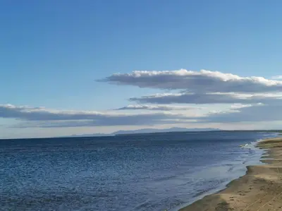 a view of the ocean from a beach with a cloudy sky at Appartement avec terrasse Classé in Port-la-Nouvelle