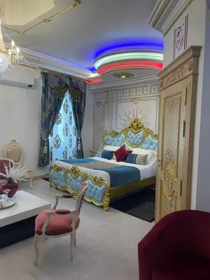 a bedroom with a bed with a rainbow on the ceiling at Suite Présidentielle Maison de L'Église in Narbonne