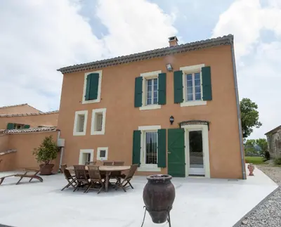 an external view of a house with a table and chairs at Château Ciceron in Ribaute