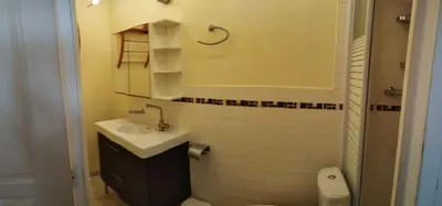 a small bathroom with a sink and a toilet at Studio centre ville de Narbonne in Narbonne