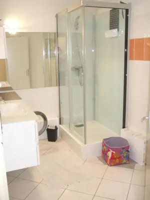 a bathroom with a shower and a sink at Appartement CarcaLuxe in Carcassonne