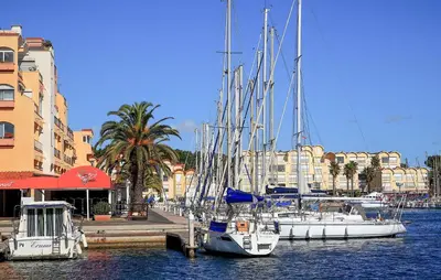a group of boats docked in a harbor with buildings at Lovely Home In Saint-Laurent-De-La-Ca in Saint-Laurent-de-la-Cabrerisse