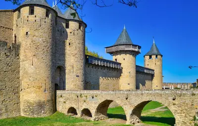 a castle with two towers and a bridge at Lovely Home In Saint-Laurent-De-La-Ca in Saint-Laurent-de-la-Cabrerisse