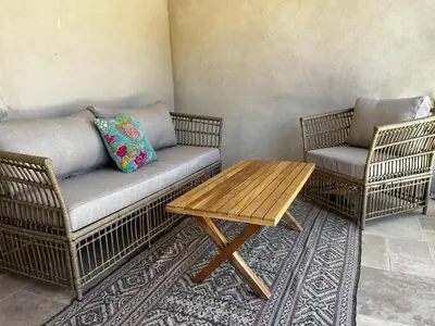a living room with a couch and two chairs and a table at La Résidence Opale in Lagrasse