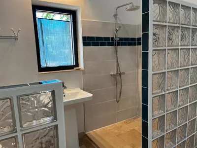 a bathroom with a shower and a sink at La Résidence Opale in Lagrasse