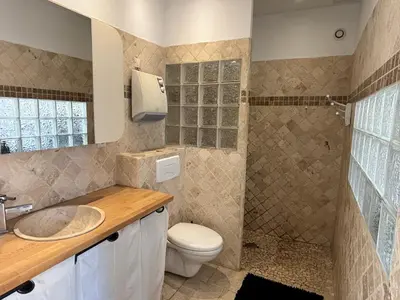 a bathroom with a toilet sink and a shower at Studio 2 personnes in Vinassan