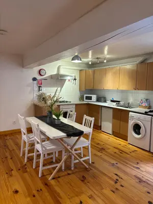 a kitchen with a table and chairs in a room at Petit Grange Puivert no 26 in Puivert