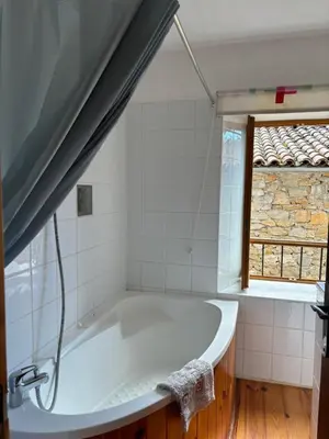 a bath tub in a bathroom with a window at Petit Grange Puivert no 26 in Puivert