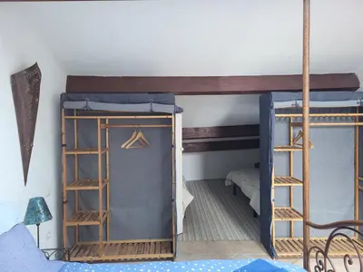 a room with two bunk beds and a bed at Le Gîte des étoiles de la Clape in Salles-d'Aude