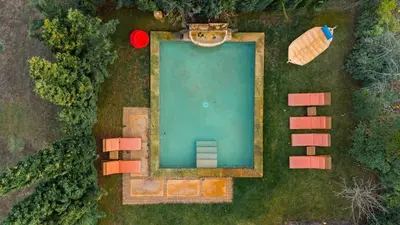 an overhead view of a swimming pool in the grass at Grande Maison de Charme a 5 mn du centre ville in Narbonne