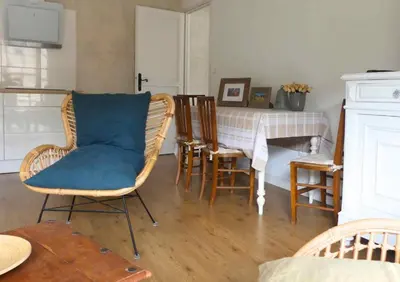 a living room with a table and chairs and a table and a tableablish at Domaine de la laugerie - relais du consul in Castres