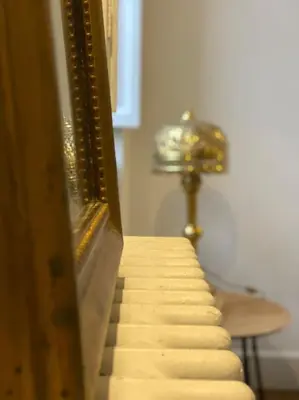 a stairway leading up to a room with a clock at Dame Carcas in Carcassonne