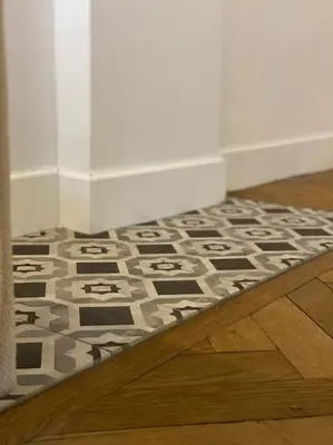 a room with a black and white rug on the floor at Dame Carcas in Carcassonne