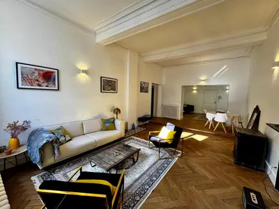 a living room with a couch and a table at Dame Carcas in Carcassonne