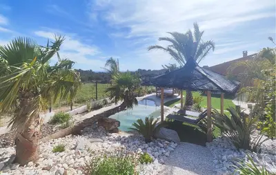 a garden with a gazebo and a swimming pool at Lovely Home In Villespassans With Wifi in Villespassans