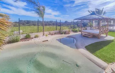 a swimming pool with a bench and a gazebo at Lovely Home In Villespassans With Wifi in Villespassans