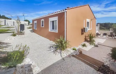 a small house in a yard with plants at Lovely Home In Villespassans With Wifi in Villespassans