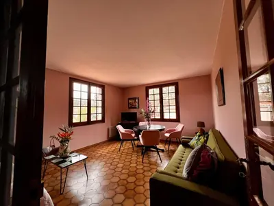 a living room with a couch and a table at Apartment with views in Limoux