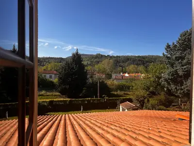 a view of a tile roof from a house at Apartment with views in Limoux