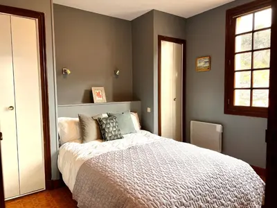 a bedroom with a bed and a window at Apartment with views in Limoux